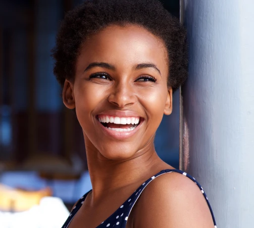 woman smiling with sunglasses on